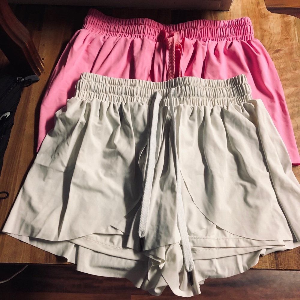 2 Xs pair of skorts! 1 hot pink pair and 1 off white pair.